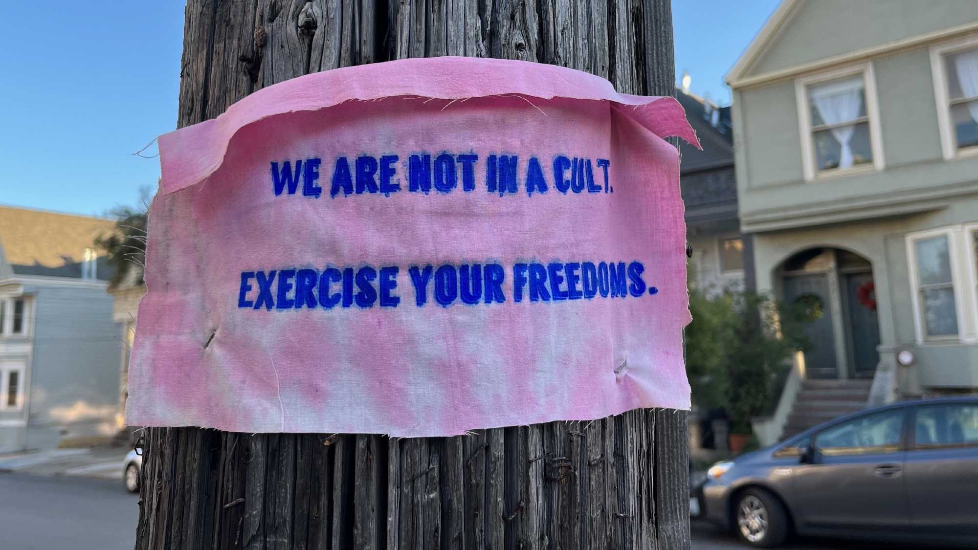 Screen printed flyer that says 'we are not in a cult'